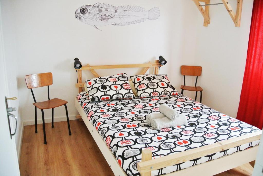 Postel nebo postele na pokoji v ubytování Nazaré Hostel - Rooms & Dorms