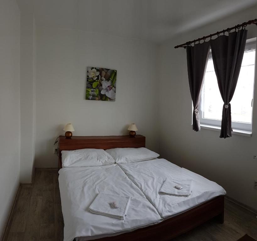Postel nebo postele na pokoji v ubytování Penzion Maja