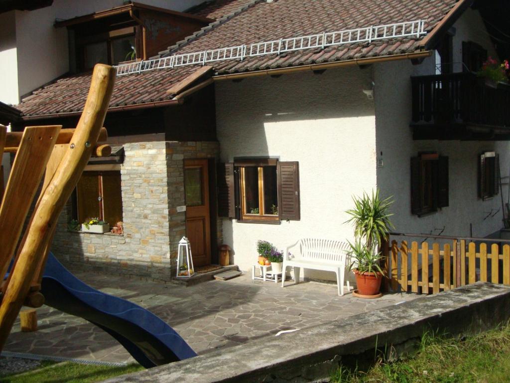 a small house with a playground in front of it at Ferienwohnung Viola in Sellrain