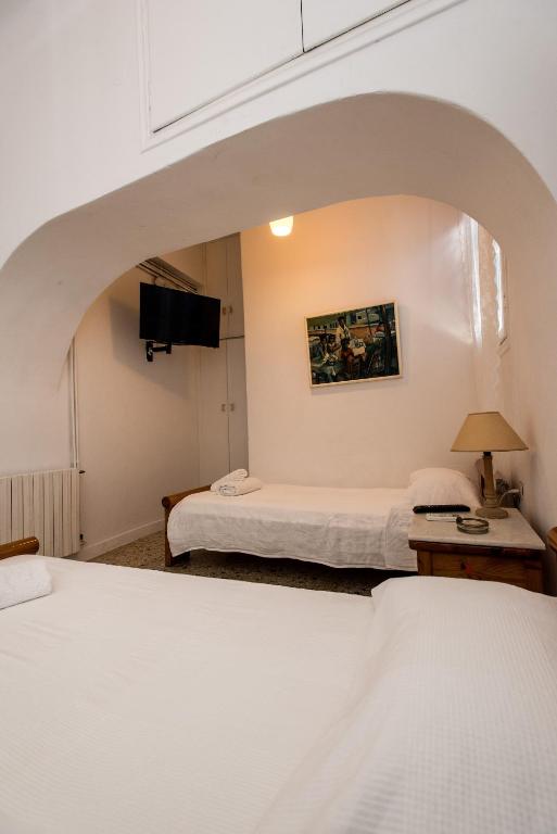 Voodi või voodid majutusasutuse Hotel Delphines toas