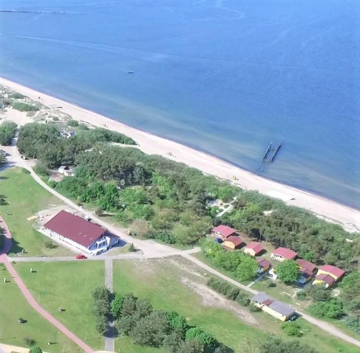 an aerial view of a beach with houses and the ocean at Relax Park in Šventoji