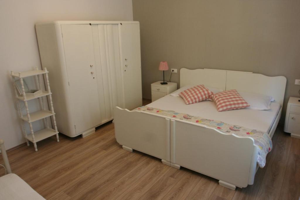 Posteľ alebo postele v izbe v ubytovaní Tiana Apartment