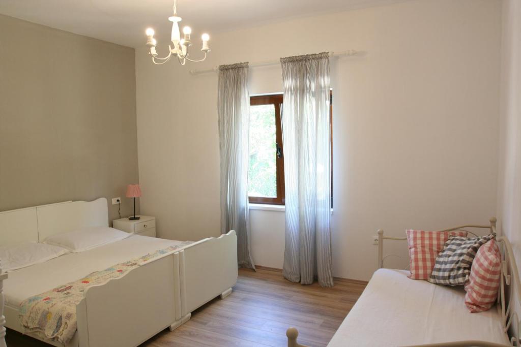 Posteľ alebo postele v izbe v ubytovaní Tiana Apartment