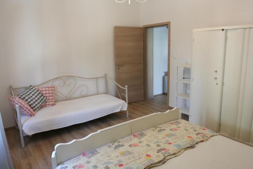 Posteľ alebo postele v izbe v ubytovaní Tiana Apartment