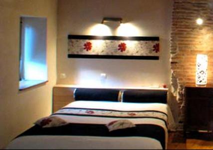 Postel nebo postele na pokoji v ubytování L'Ancien Presbytère