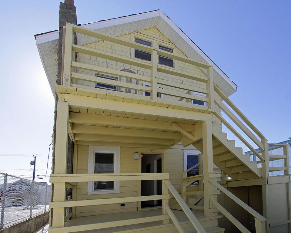 a house with a staircase on the side of it at Shore Beach Houses - 38 C Lincoln Avenue in Seaside Heights