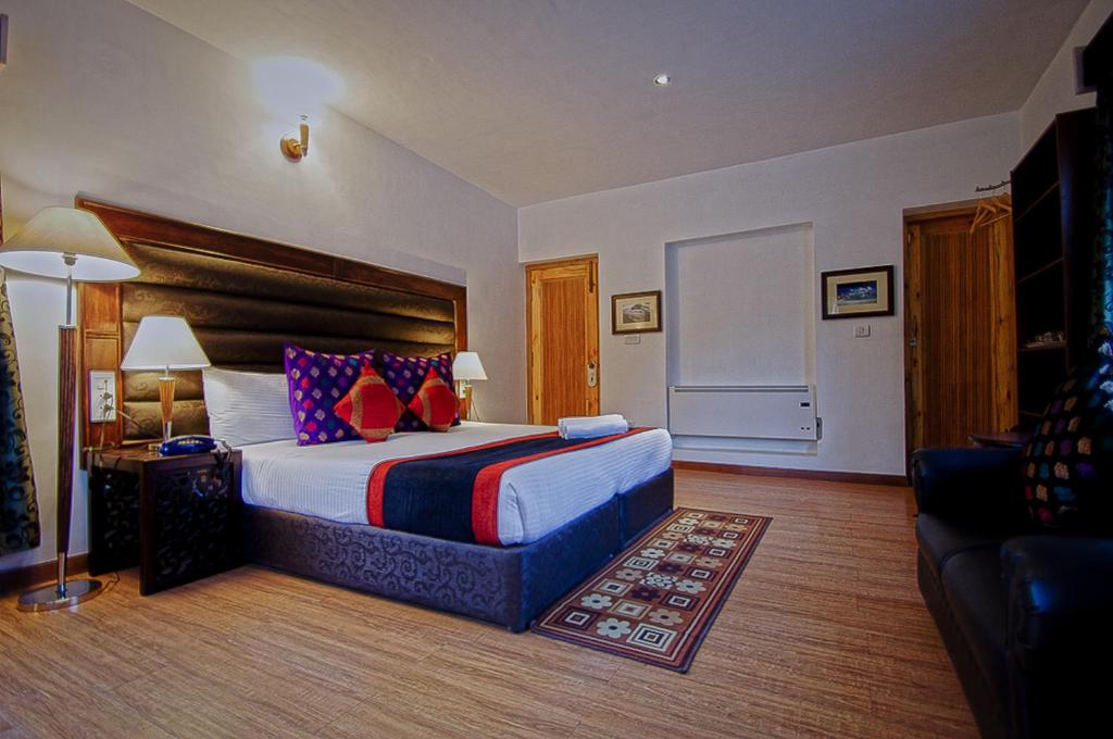 Postel nebo postele na pokoji v ubytování Gomang Boutique Hotel