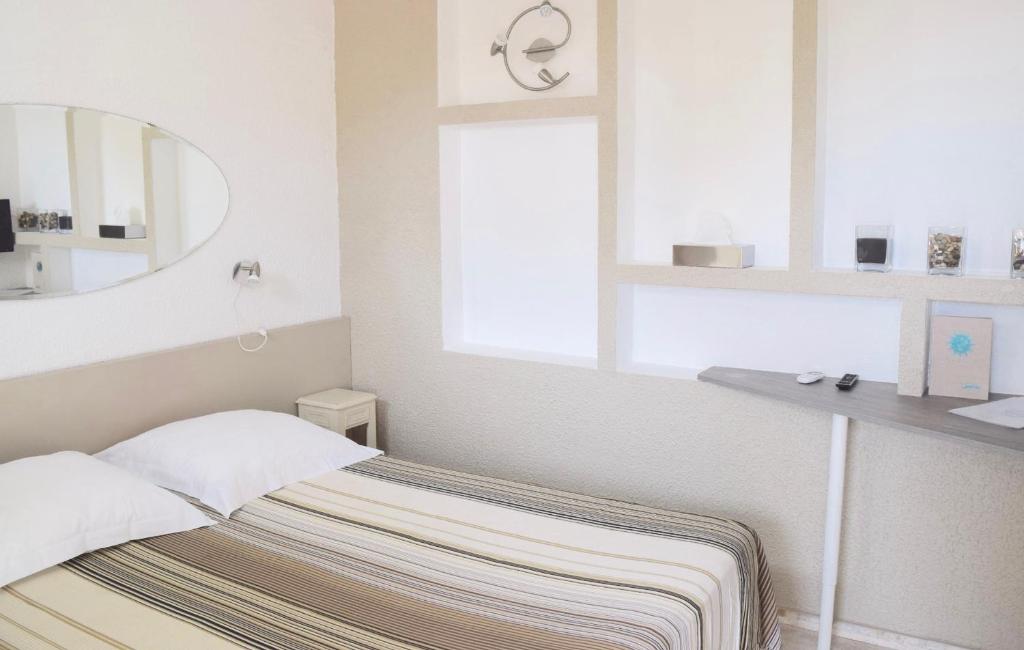 Postel nebo postele na pokoji v ubytování Hotel L'Orangeraie