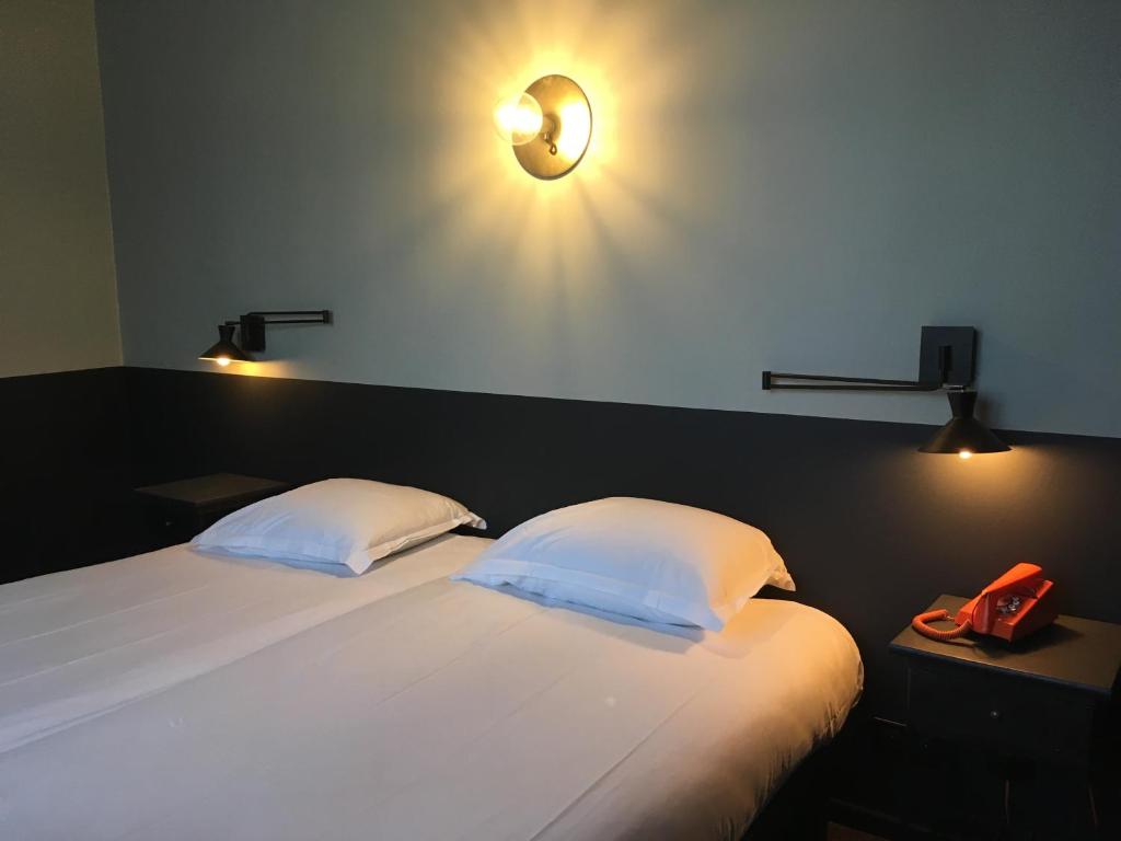 Ένα ή περισσότερα κρεβάτια σε δωμάτιο στο Hotel Alnea