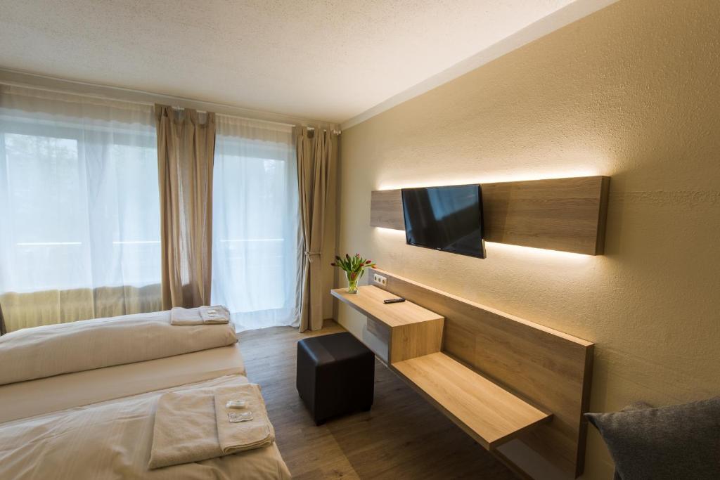 Postel nebo postele na pokoji v ubytování Ahorn Hotel