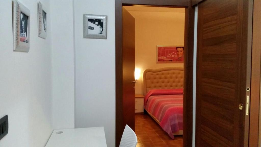 Postel nebo postele na pokoji v ubytování B&B Holidays Artisti