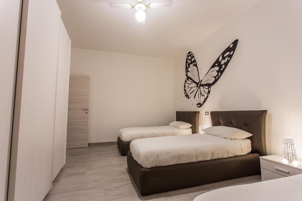 Postel nebo postele na pokoji v ubytování LM House