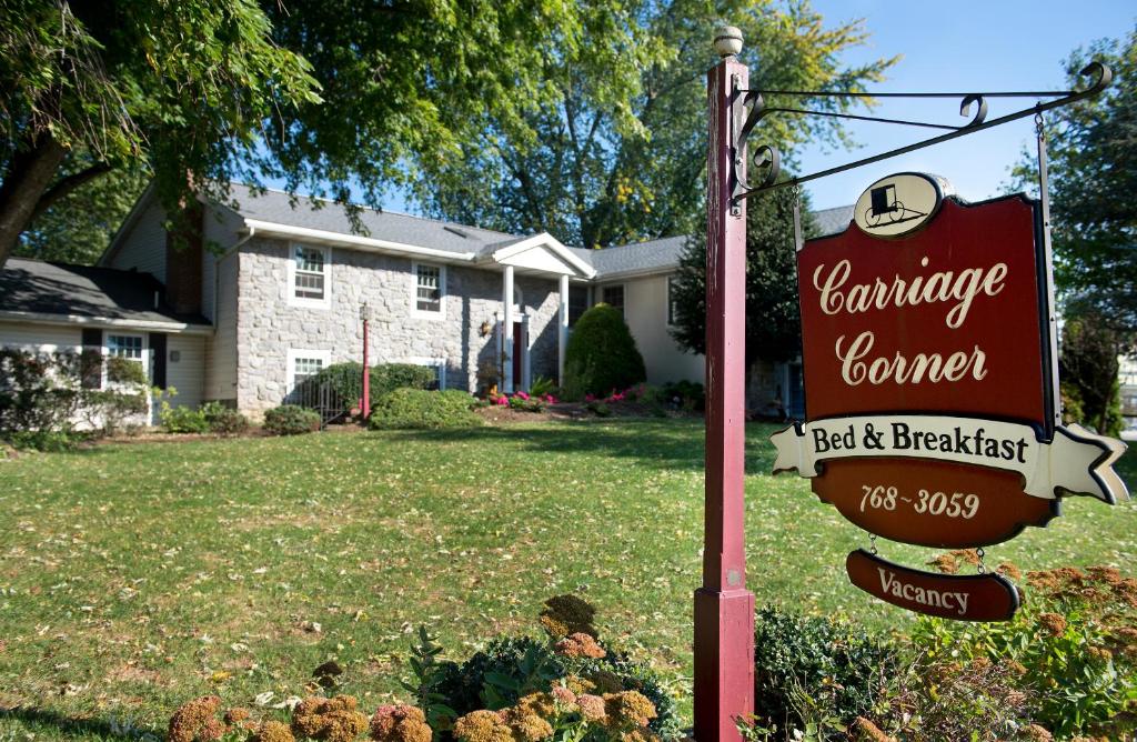 a sign in a yard in front of a house at Carriage Corner Bed & Breakfast in Gordonville