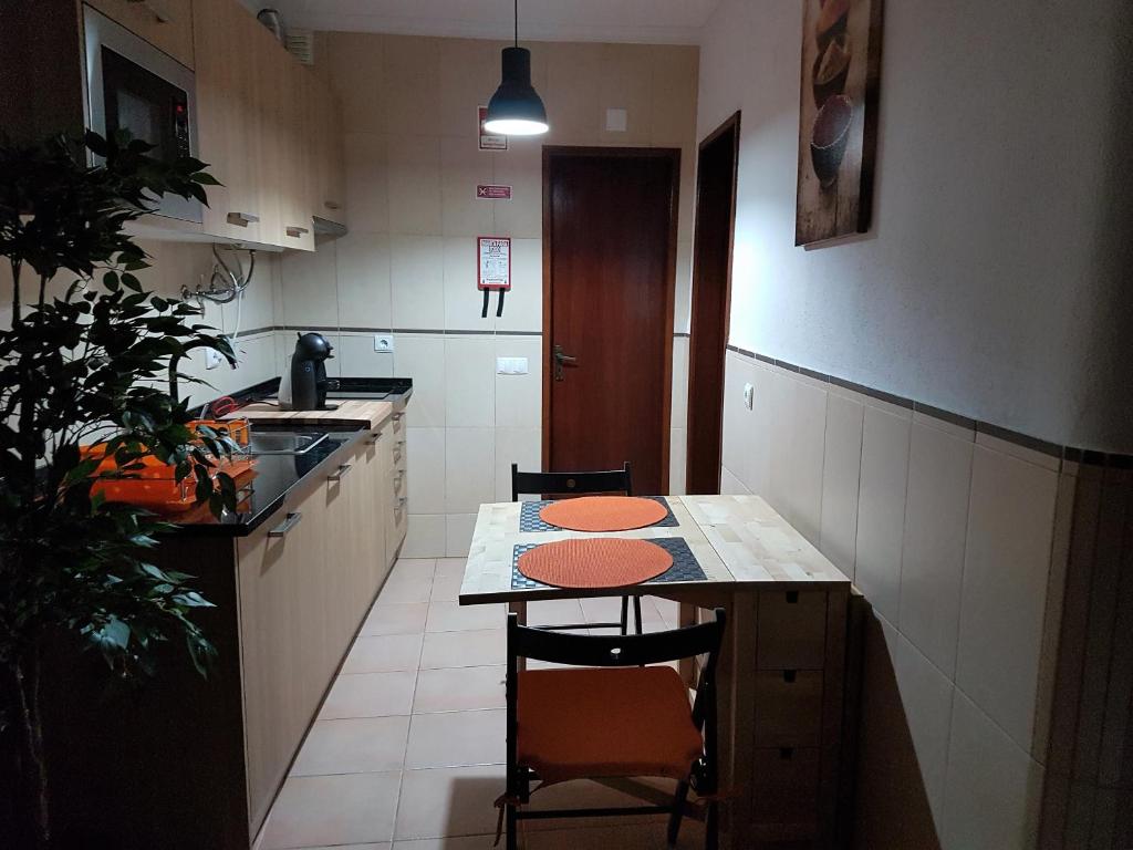 Kuchyň nebo kuchyňský kout v ubytování Villa Oliveira Apartments