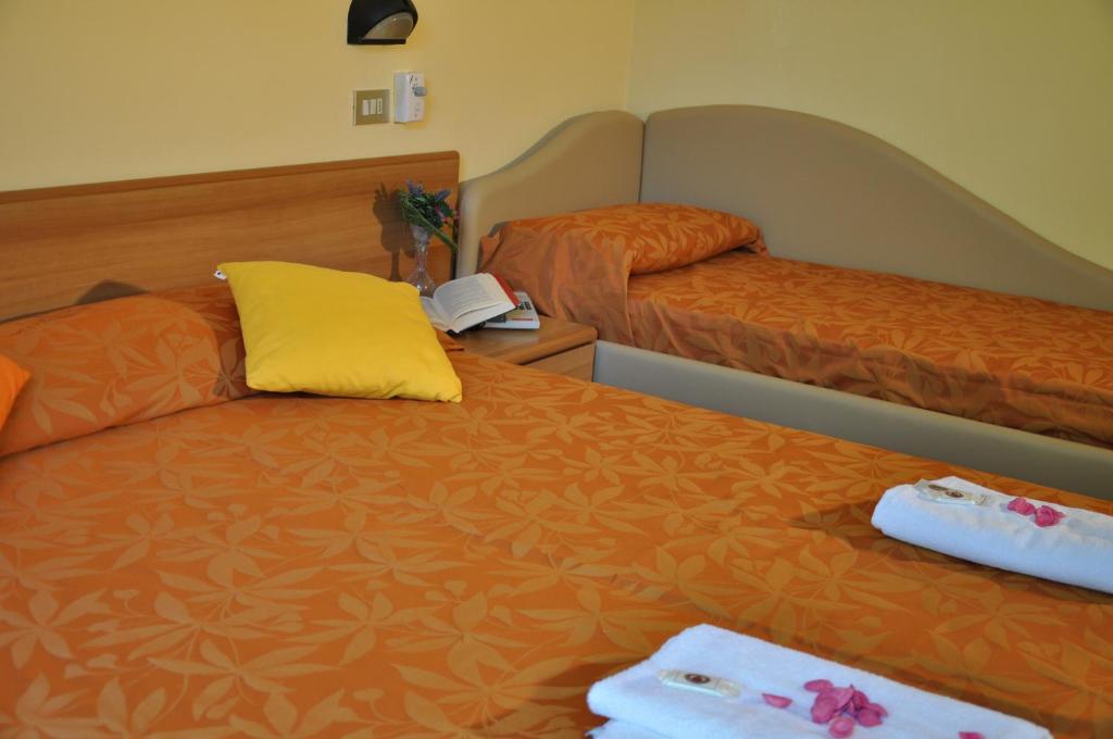 Postel nebo postele na pokoji v ubytování Hotel Festival