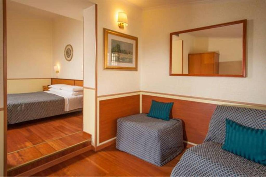 Posteľ alebo postele v izbe v ubytovaní Hotel Piemonte