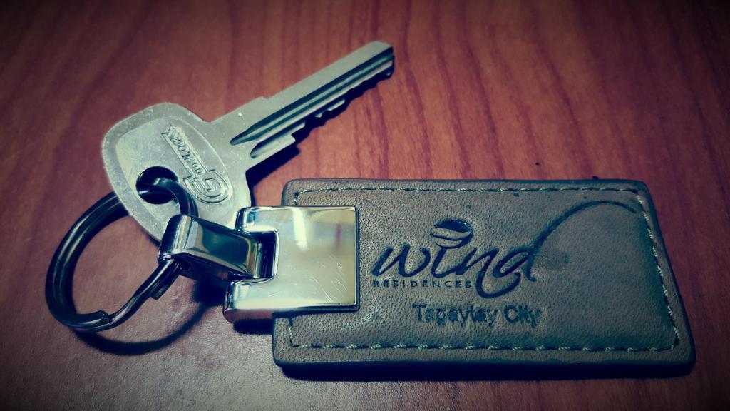 a pair of keys on a key chain on a table at Suite 16 in Tagaytay