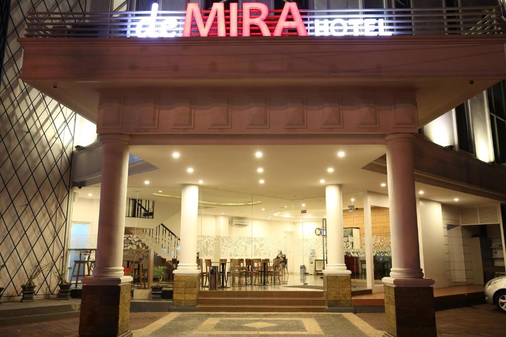 a store front with a sign on top of it at DeMira Hotel in Surabaya