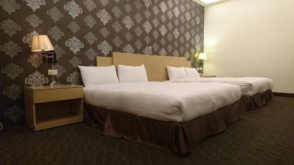 Postel nebo postele na pokoji v ubytování Dreamer Hotel