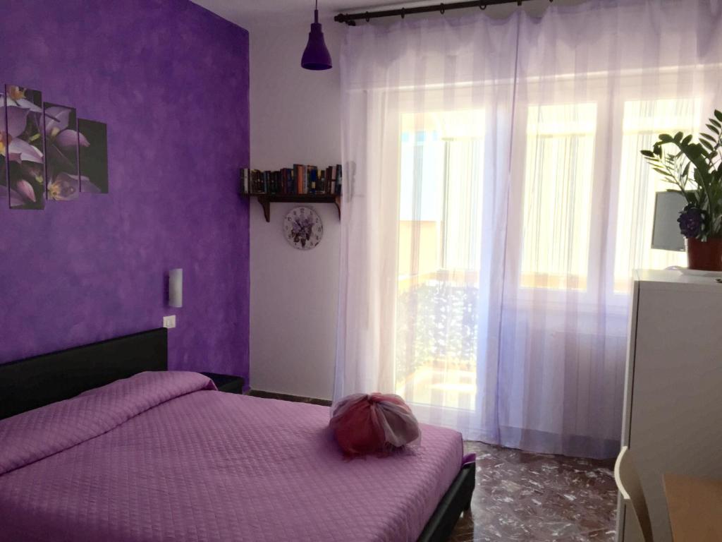 Łóżko lub łóżka w pokoju w obiekcie B&b Cefalù