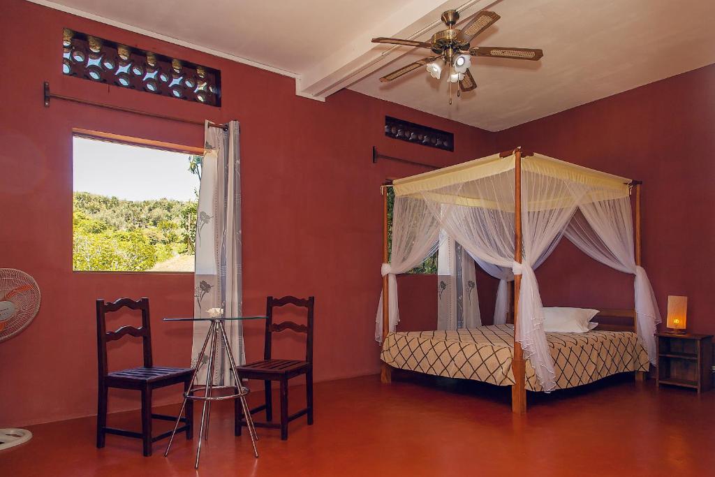Ένα ή περισσότερα κρεβάτια σε δωμάτιο στο Hotel Nautile