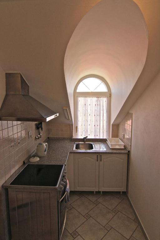 Kuchyň nebo kuchyňský kout v ubytování Guest House Maxim