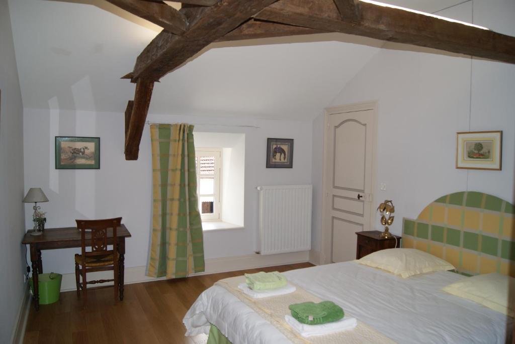 Postel nebo postele na pokoji v ubytování Château de Fontnoble