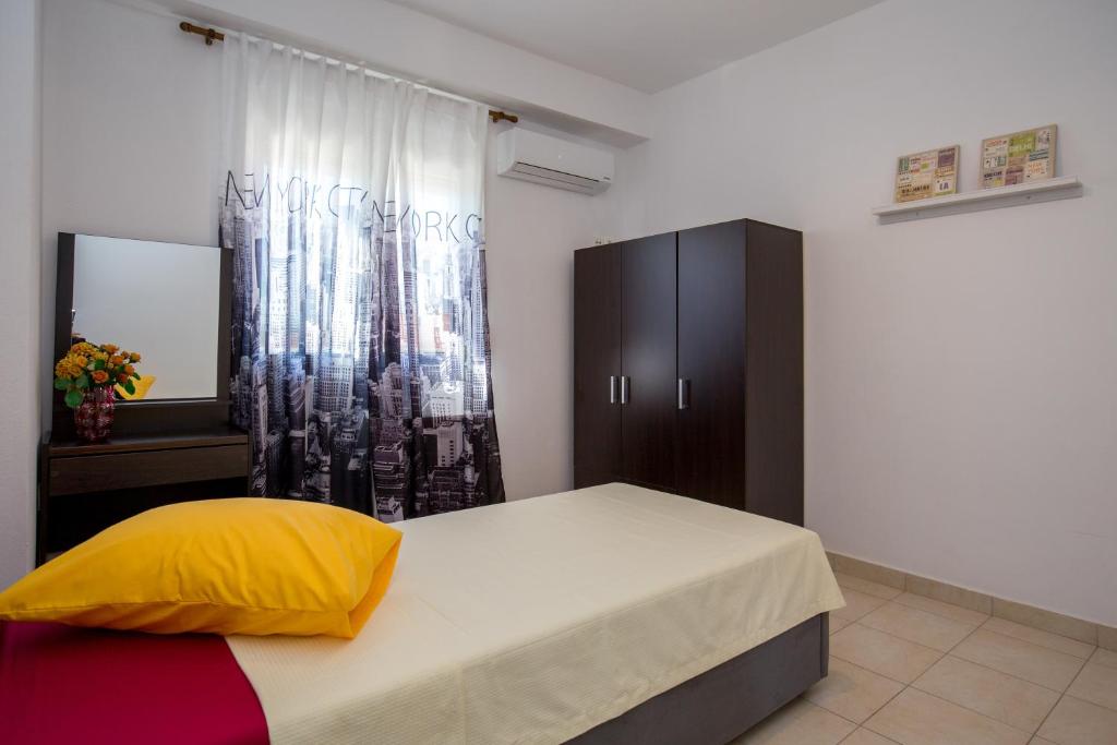 Postel nebo postele na pokoji v ubytování Grande Apartments