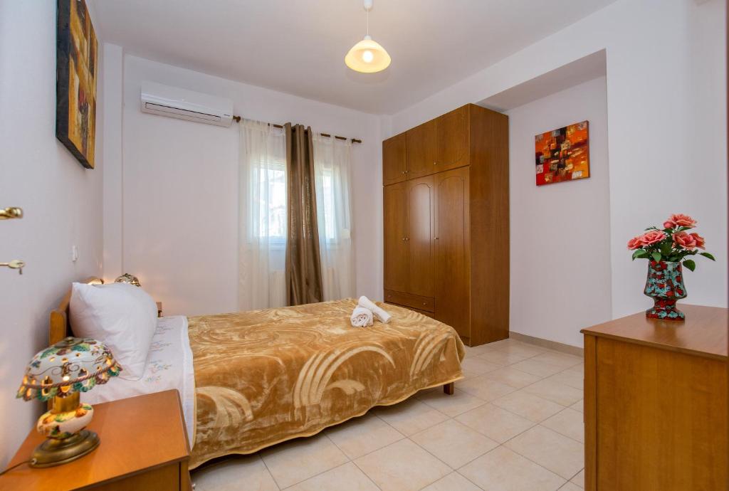 Postel nebo postele na pokoji v ubytování Grande Apartments