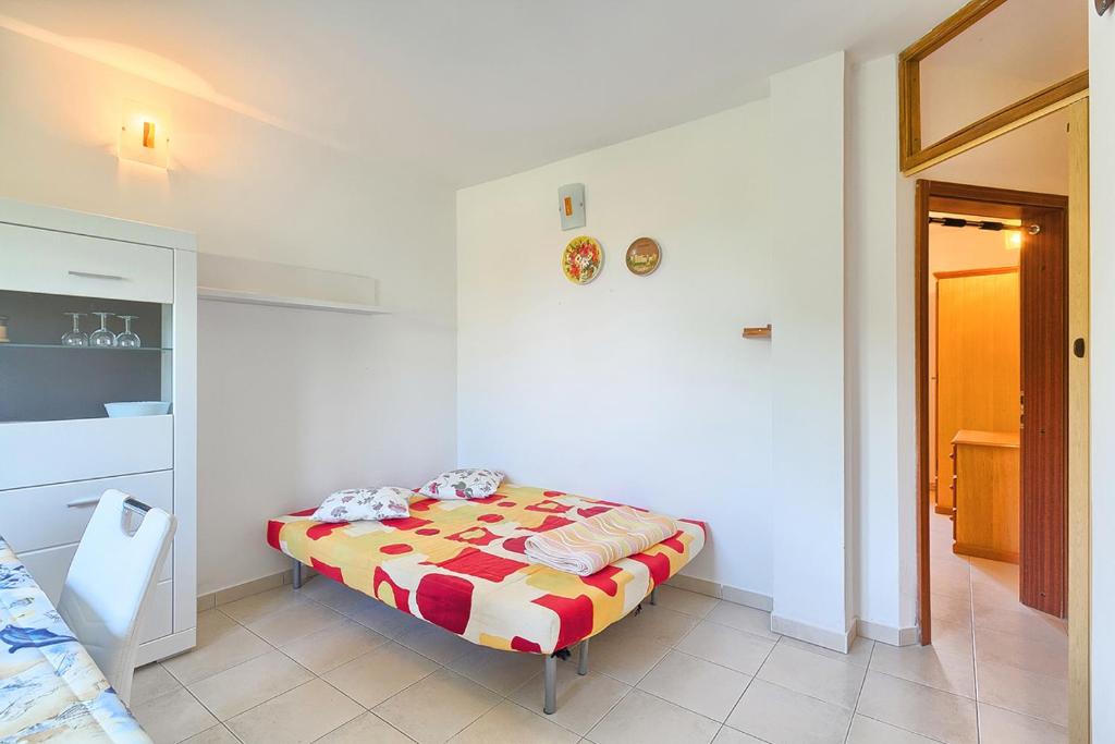 Łóżko lub łóżka w pokoju w obiekcie Apartments Kamenjak