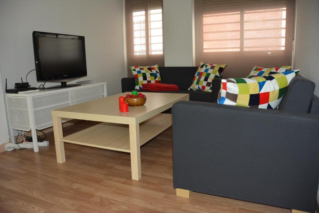 a living room with a couch and a tv at For You Rentals Barrio del Pilar apartment SAR28 in Madrid