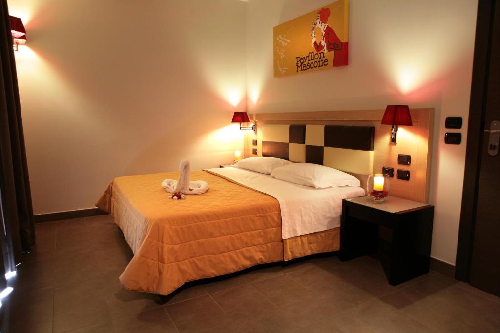 Postel nebo postele na pokoji v ubytování Hotel Visagi