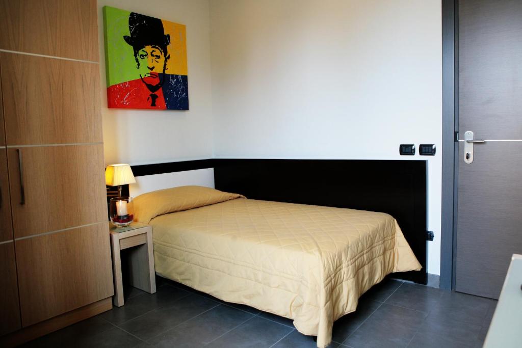 Postel nebo postele na pokoji v ubytování Hotel Visagi