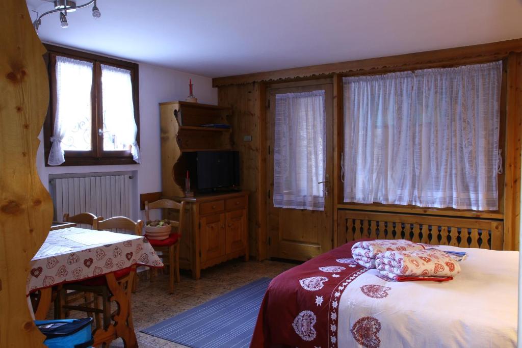 Postel nebo postele na pokoji v ubytování Chalet dell'Ermellino