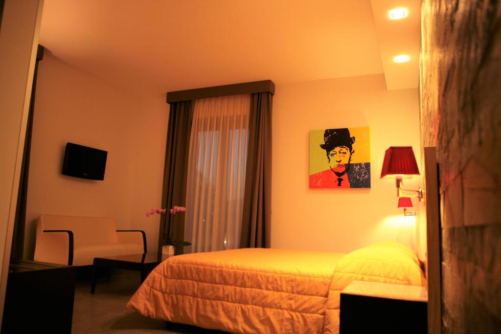 Postel nebo postele na pokoji v ubytování Hotel Visagi