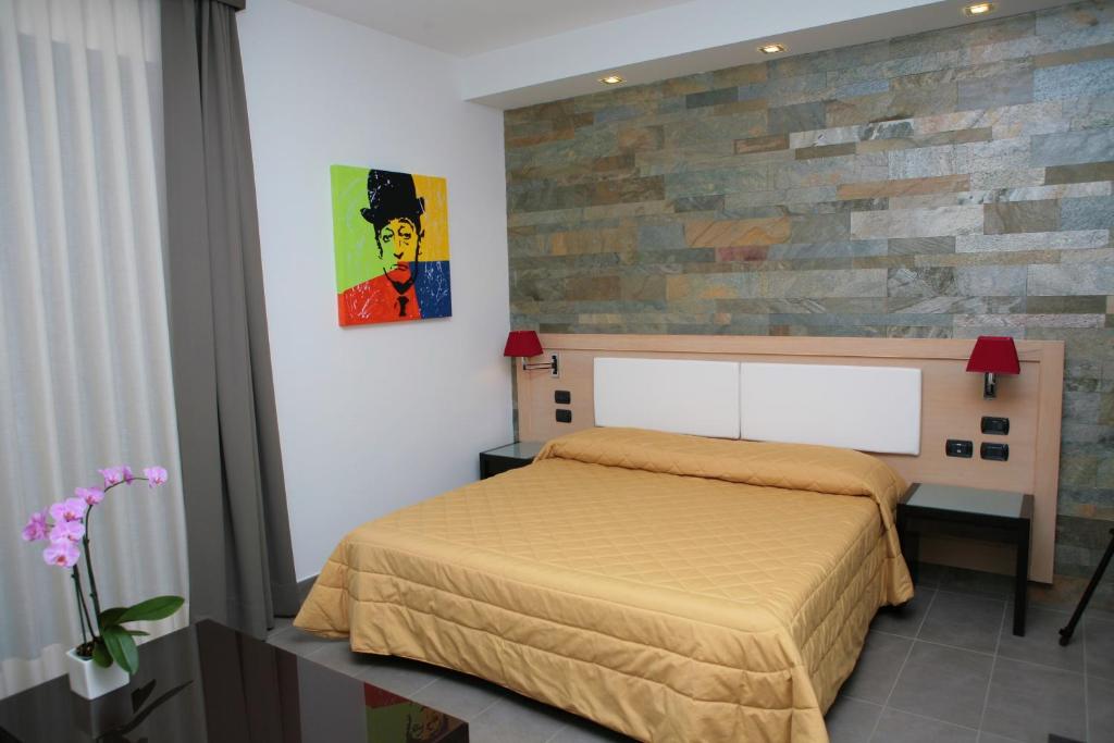 Postel nebo postele na pokoji v ubytování Hotel Visagi