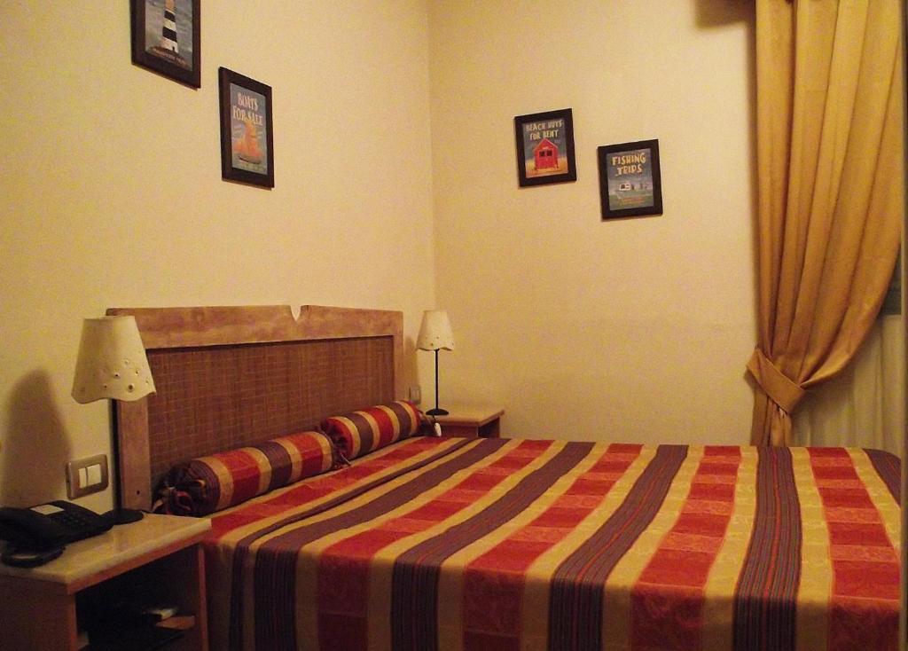 Postel nebo postele na pokoji v ubytování Hotel Morgana
