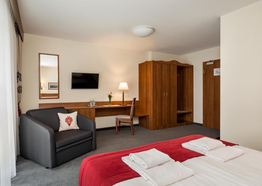 Postel nebo postele na pokoji v ubytování Hotel Logos