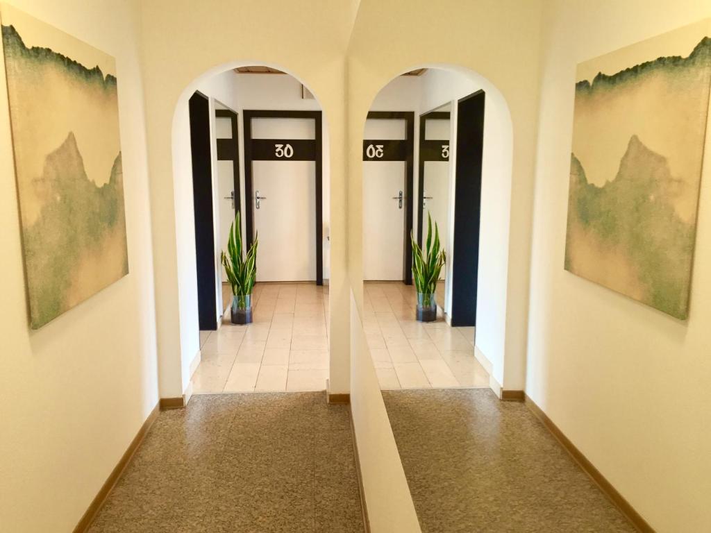 a hallway with three doors in a building at Haus Stallmeister in Lippstadt