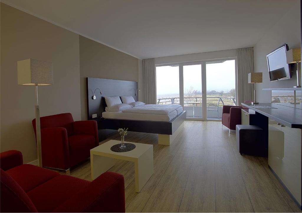 Postel nebo postele na pokoji v ubytování Strandhotel Bene