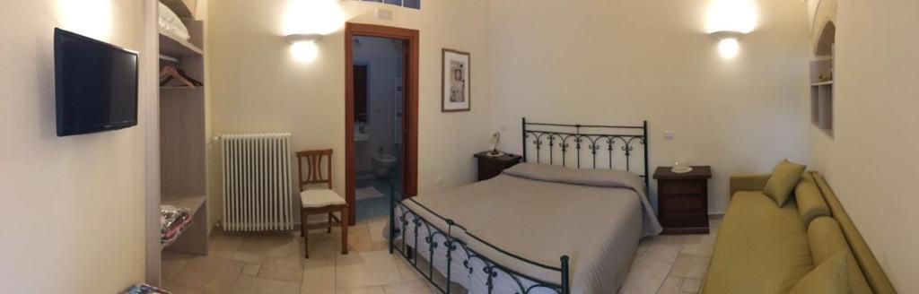 Postel nebo postele na pokoji v ubytování B&B San Potito