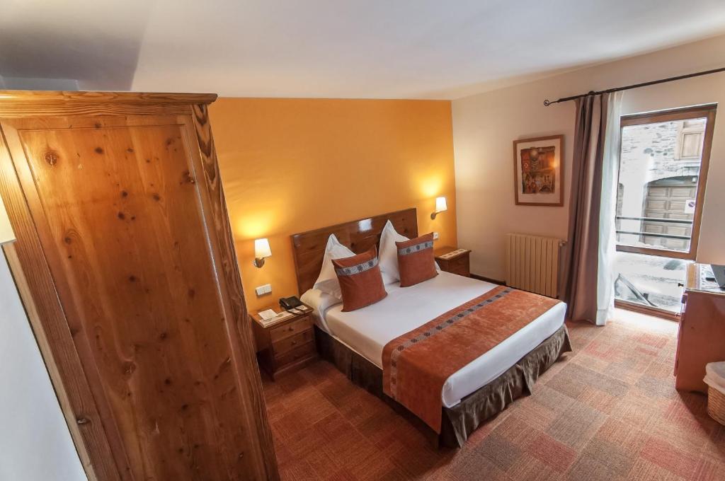 Postel nebo postele na pokoji v ubytování Hotel Vilagaros