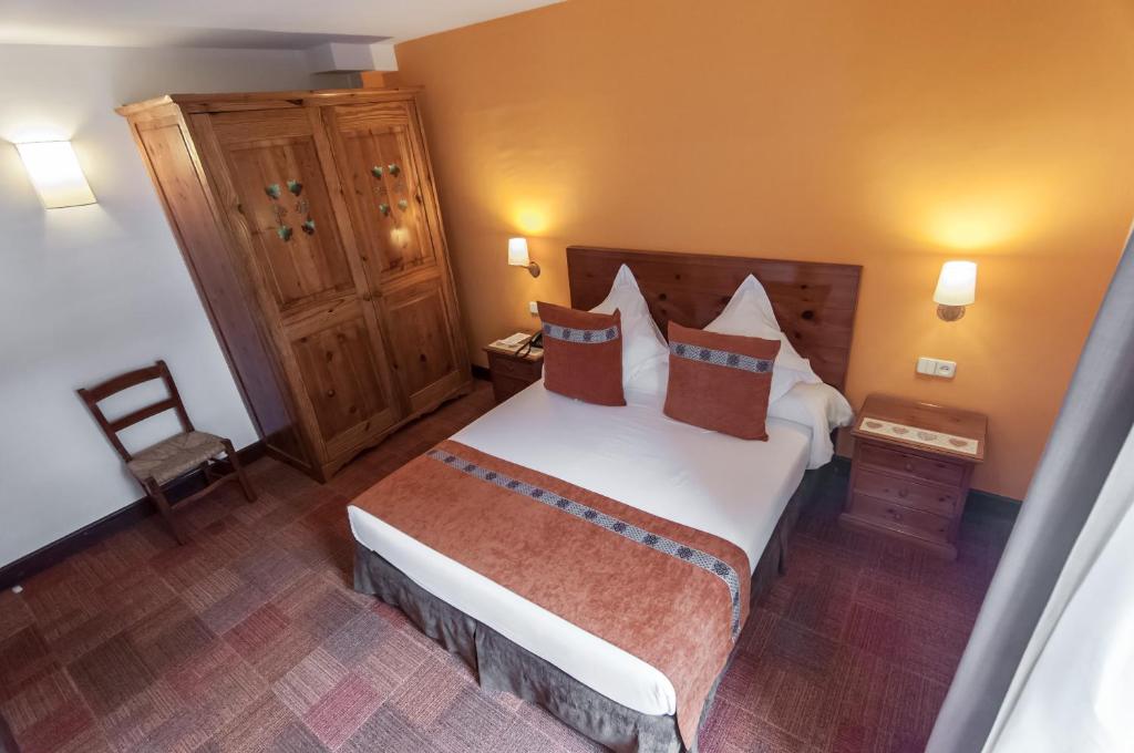 Postel nebo postele na pokoji v ubytování Hotel Vilagaros