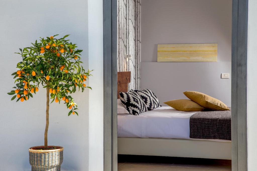 Postel nebo postele na pokoji v ubytování Urban Garden Hotel