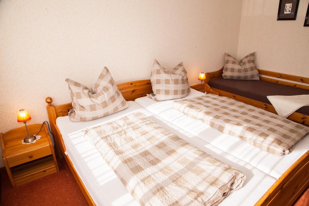 Postel nebo postele na pokoji v ubytování Haus Cristallo