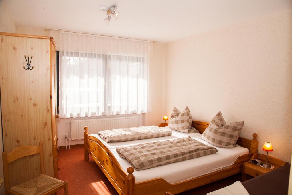 Postel nebo postele na pokoji v ubytování Haus Cristallo