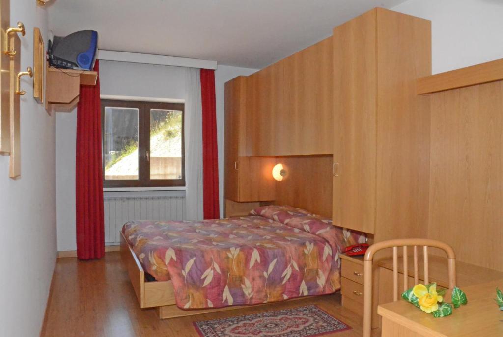 Posteľ alebo postele v izbe v ubytovaní Hotel Negritella