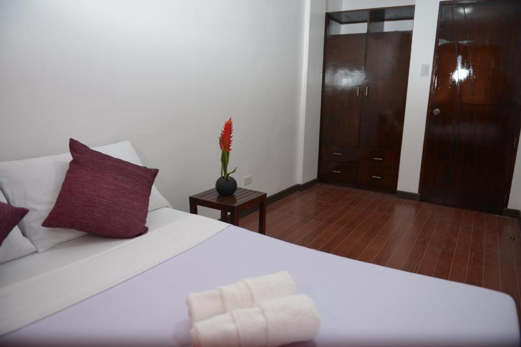 Postel nebo postele na pokoji v ubytování Globetrotter Inn - Palawan Inc.