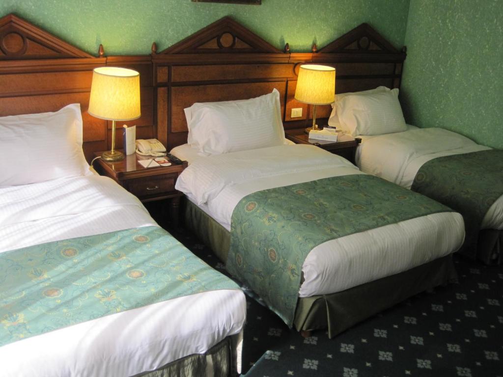 Postel nebo postele na pokoji v ubytování Serenada Golden Palace - Boutique Hotel