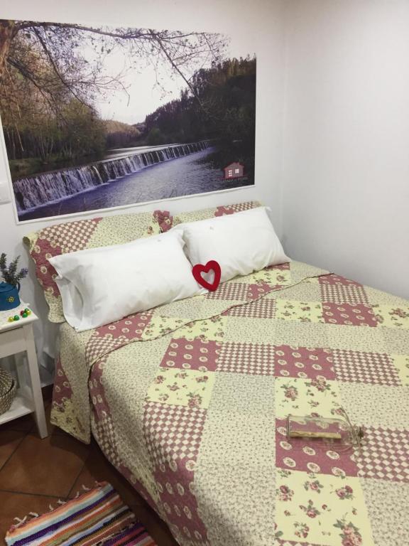 Postel nebo postele na pokoji v ubytování Casinha de Pedra